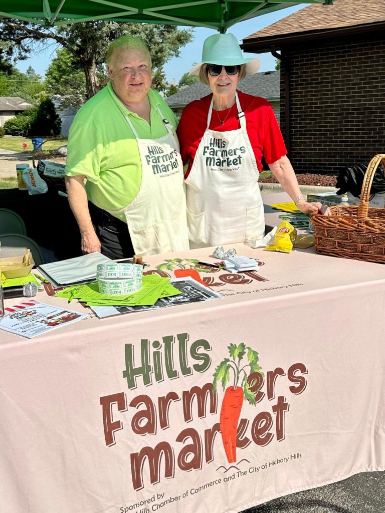 Hills Chamber of Commerce members, Art Golden and Phyllis Majka on opening day of the Hills Farmers Market in 2023. (File photo)